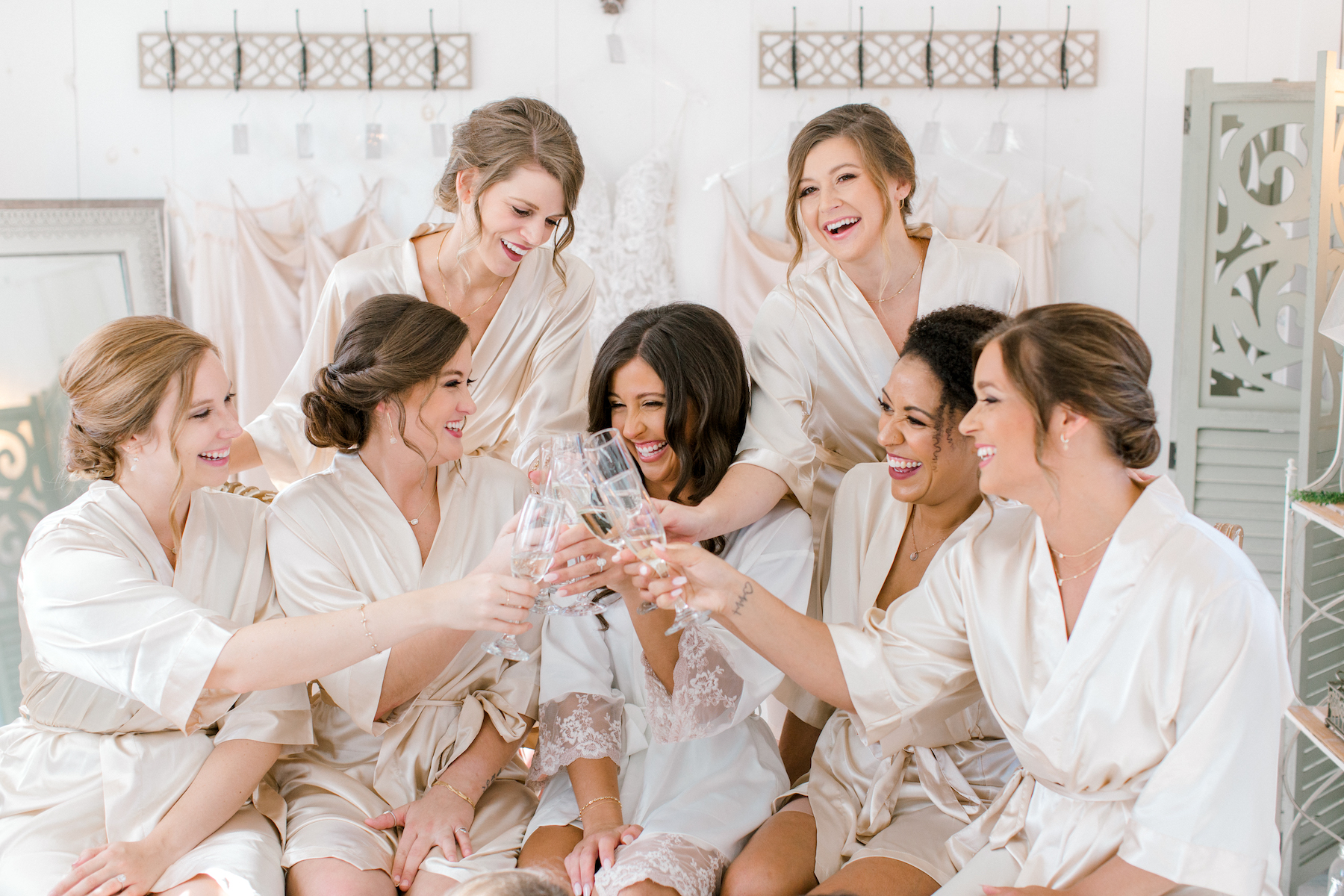 Bridal party celebrating while getting ready